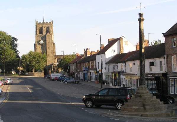 View of St Gregory' church and the Market Cross from the Market Place
